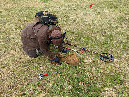 A metal detectorist volunteers with MHT at Fort Frederick State Park